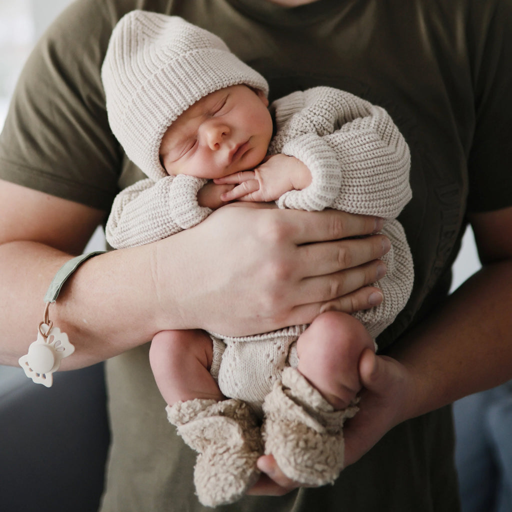 infant sleeping with frigg binky