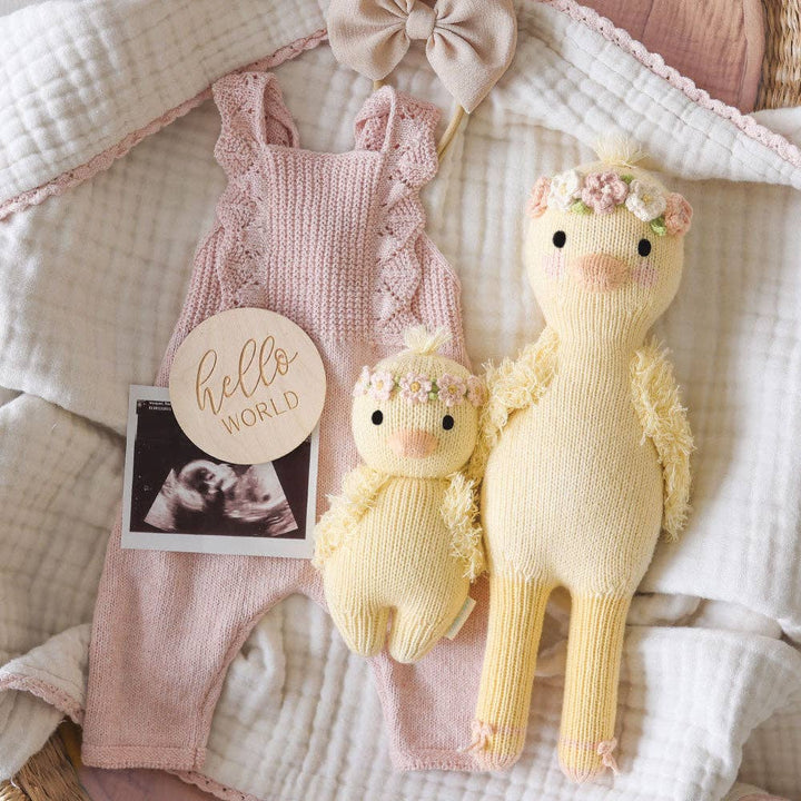 Gentle Cuddle + Kind Baby Duckling plush toy with blush floral accents, perfect for nursery play