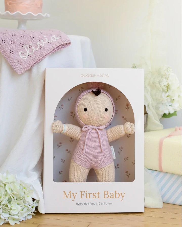 Lavender My First Baby from Cuddle + Kind, a hand-knit cotton doll that gives 10 meals to kids in need