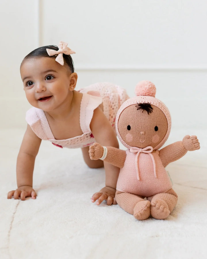 Hand-knit baby doll: Cuddle + Kind My First Baby Peach, a 14-inch natural cotton first doll from newborn