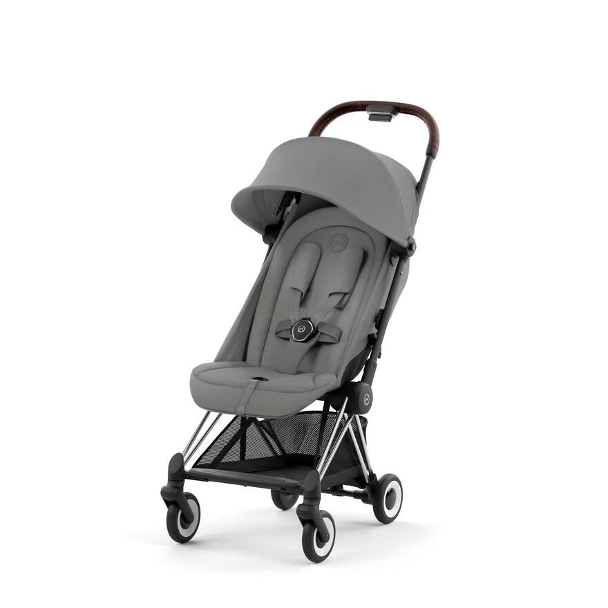 Matte Black + Mirage Grey Cybex Coya, a stylish travel stroller for parents on the move.