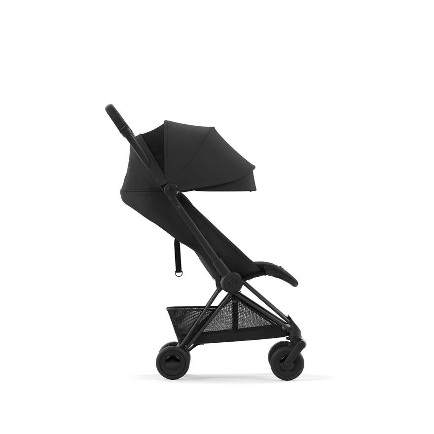 Cybex Coya stroller with Matte Black + Cozy Beige, compact for easy travel.