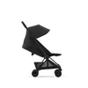 Travel system stroller Cybex Coya in Matte Black + Leaf Green for a durable yet stylish design.