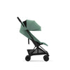 Off White Cybex Coya stroller, the ultimate compact stroller for travel.