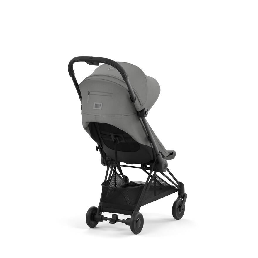 Matte Black + Peach Pink Cybex Coya stroller, offering vibrant elegance for your travels.