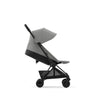 Peach Cybex Coya travel stroller, ideal for stylish journeys with your little one.