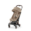 Green Cybex Coya stroller, ideal for plane travel with its lightweight and compact features.