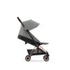 Pink Cybex Coya travel stroller, perfect for easy air travel with a newborn.