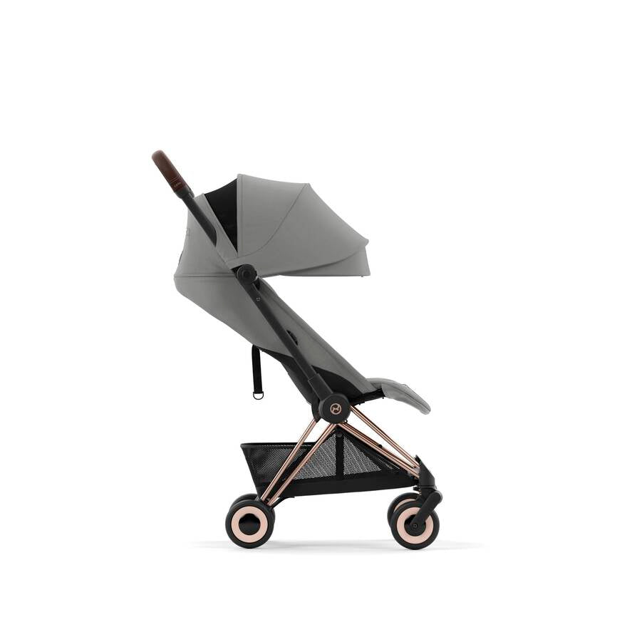 Rose Gold and Pink Cybex Coya, a top choice for lightweight travel strollers.