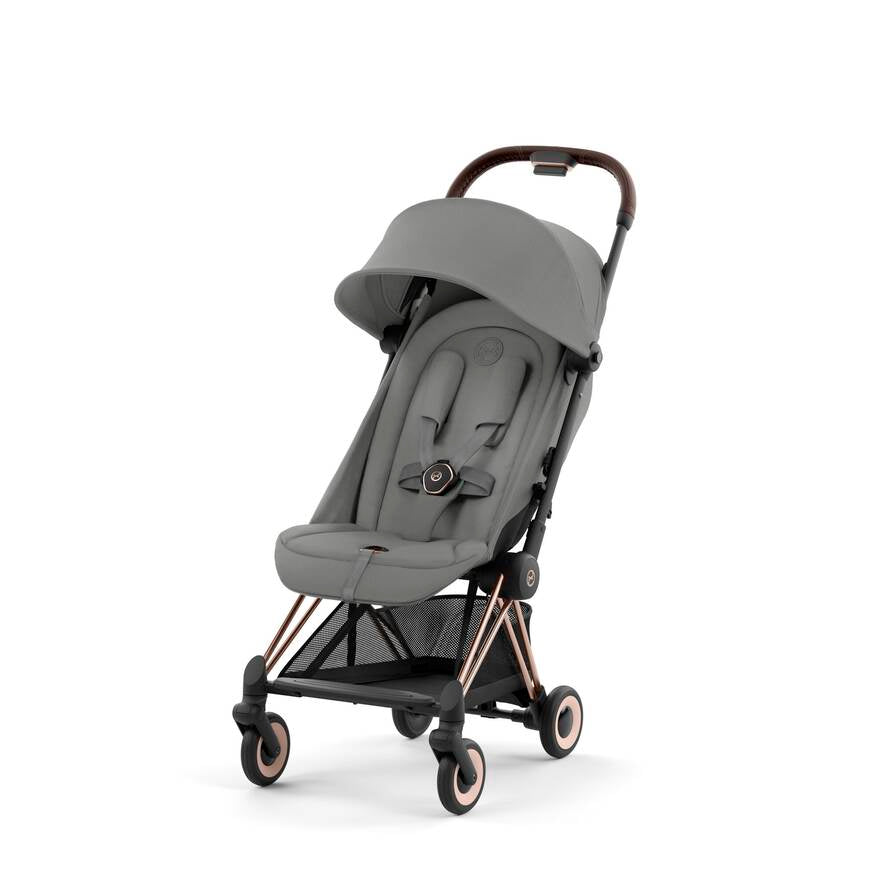 RoseGold + Sepia Black Cybex Coya, a versatile stroller for traveling with your baby.