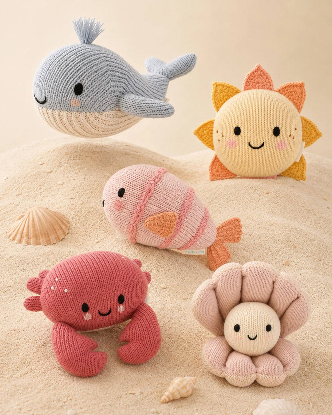 Baby Crab in Blush by Cuddle + Kind, a 7-inch knit crab stuffed animal that gives 5 meals