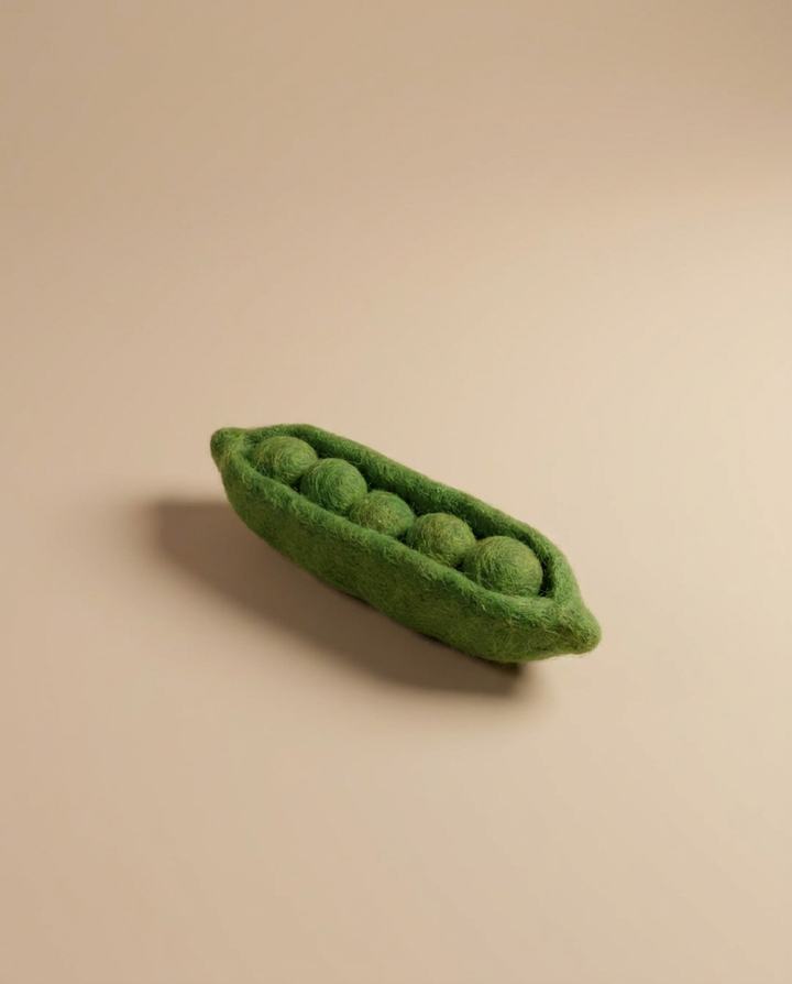 Close-up of Kaddu's Felt Green Peas pod showing handcrafted wool detail