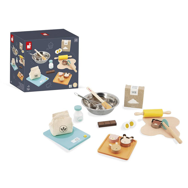 Child playing bakery with Janod My Pastry Workshop wooden toy set