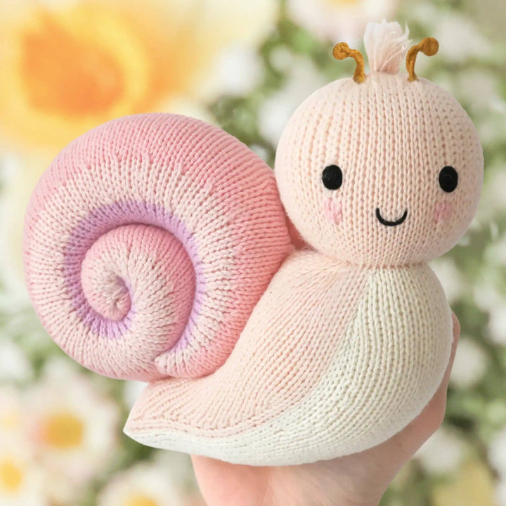 Peony pink baby snail plush — Cuddle + Kind hand-knit stuffed animal for toddlers and babies
