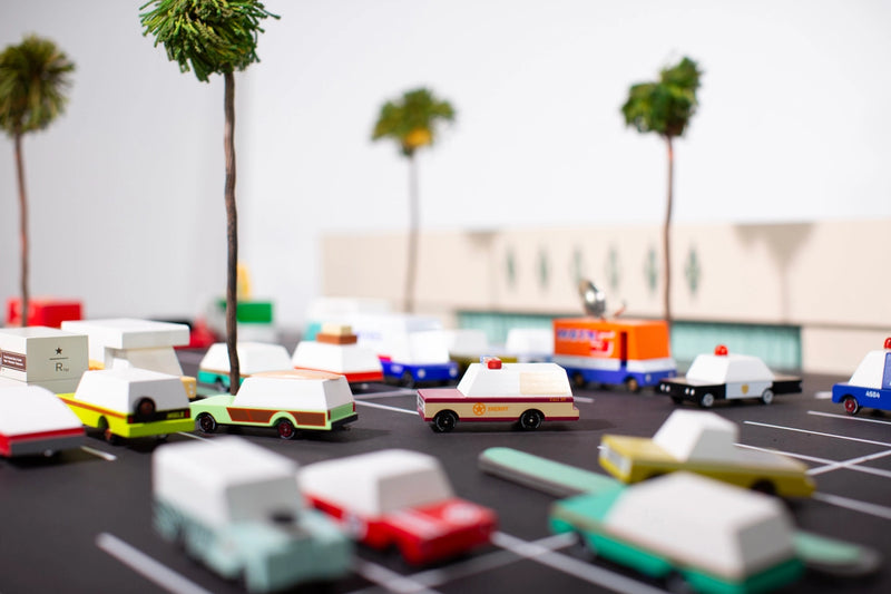 A Candylab Toys wooden pizza van on display, ideal for children to use in their pretend food delivery games.