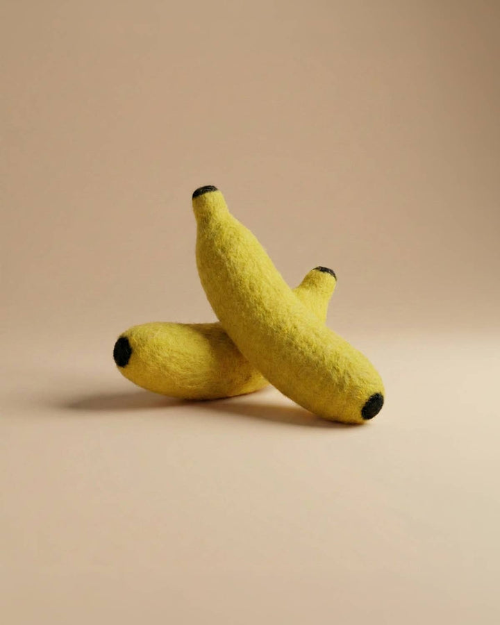 Two Felt Bananas by Kaddu stacked together, perfect Montessori pretend play fruit