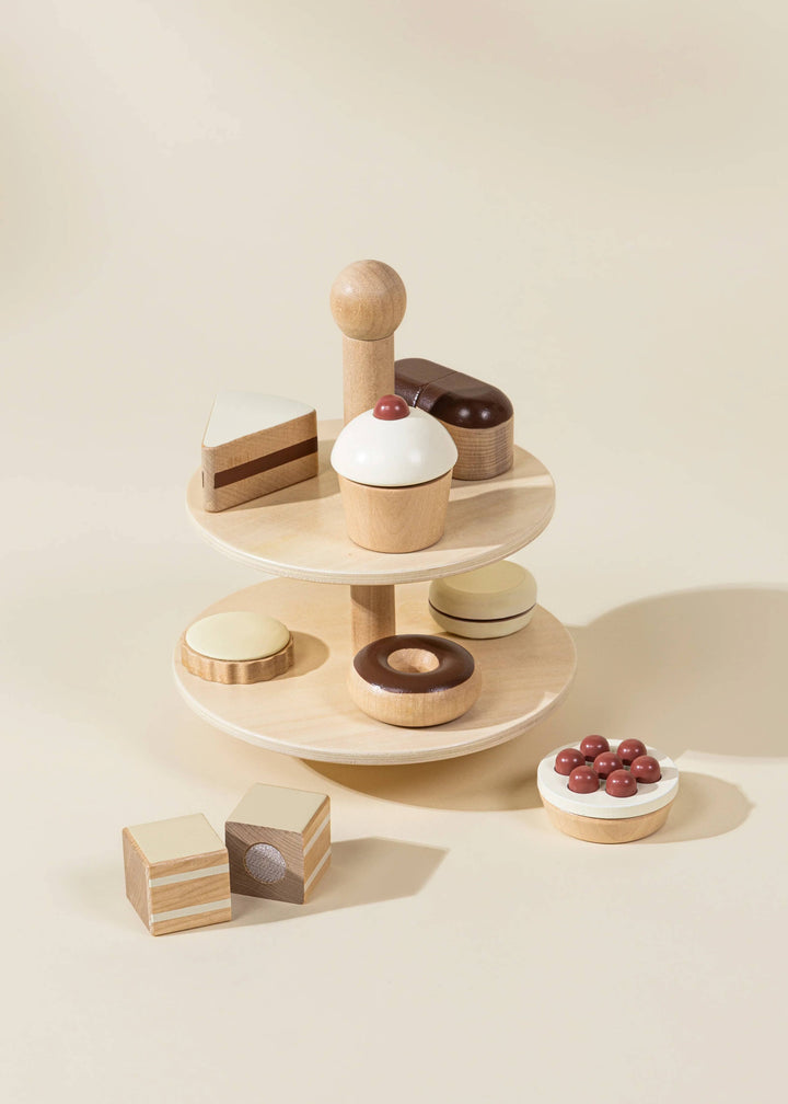 Stack up sweet imaginary fun with the Coco Village Wooden Desserts Tower, a charming play food toy for creative little chefs.