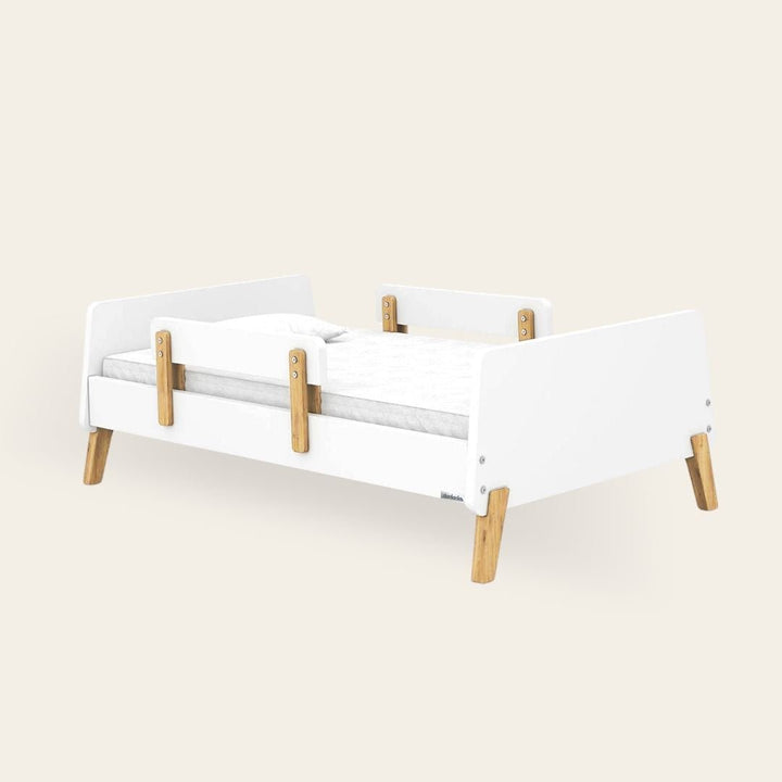 White + Natural dadada Muse toddler bed with artisan-style rubberwood leg joints