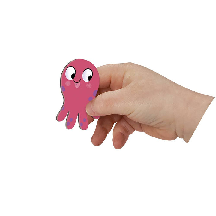 Child holding a magnetic toys octopus piece from Janod's Magneti'stories The Seabed
