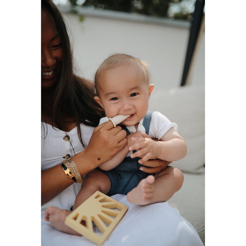 Mushie Sun Teether Bright and cheerful sun-shaped teether from Mushie ideal for soothing teething babies