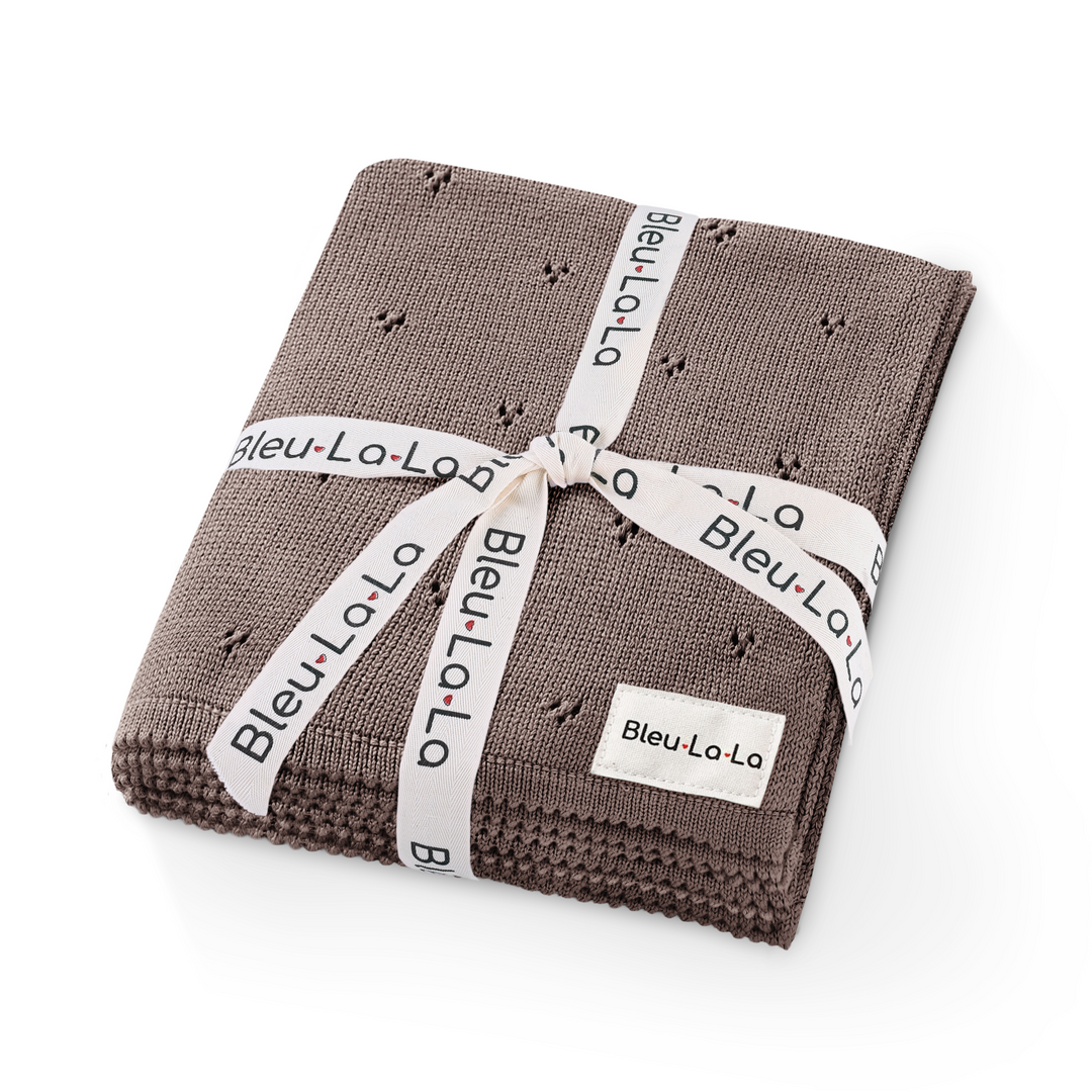 Bleu La La Organic Pointelle Luxury Knit Swaddle Blanket in milk chocolate, folded with ribbon to highlight organic cotton gift presentation.