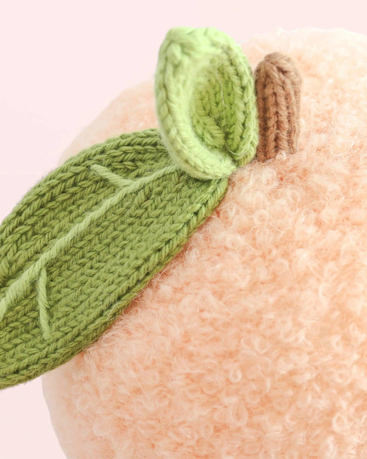 Cuddle + Kind Baby Peach, hand-knit fruit plush toy for babies