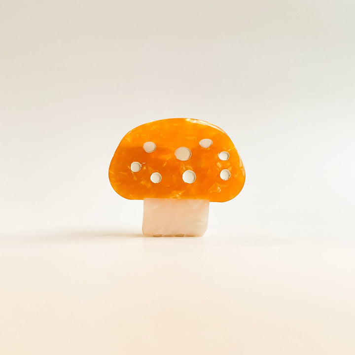 Adorro Alice Mushroom Claw Clip lifestyle image styled in hair showing small secure fit perfect hair accessory for fine toddler hair