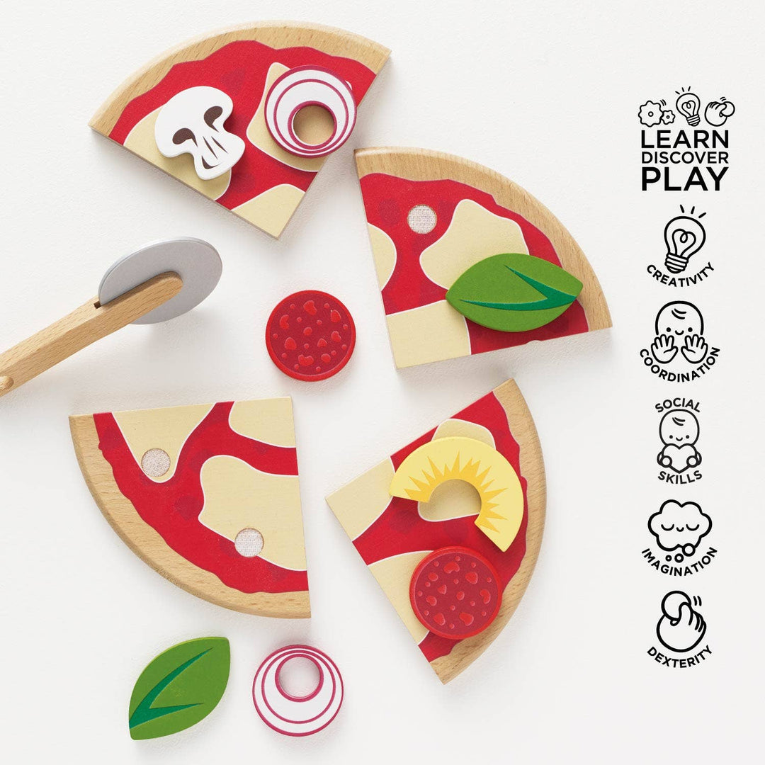 Loose pizza slices and toppings scatter beside a wooden cutter in Le Toy Van's Pizza & Toppings set