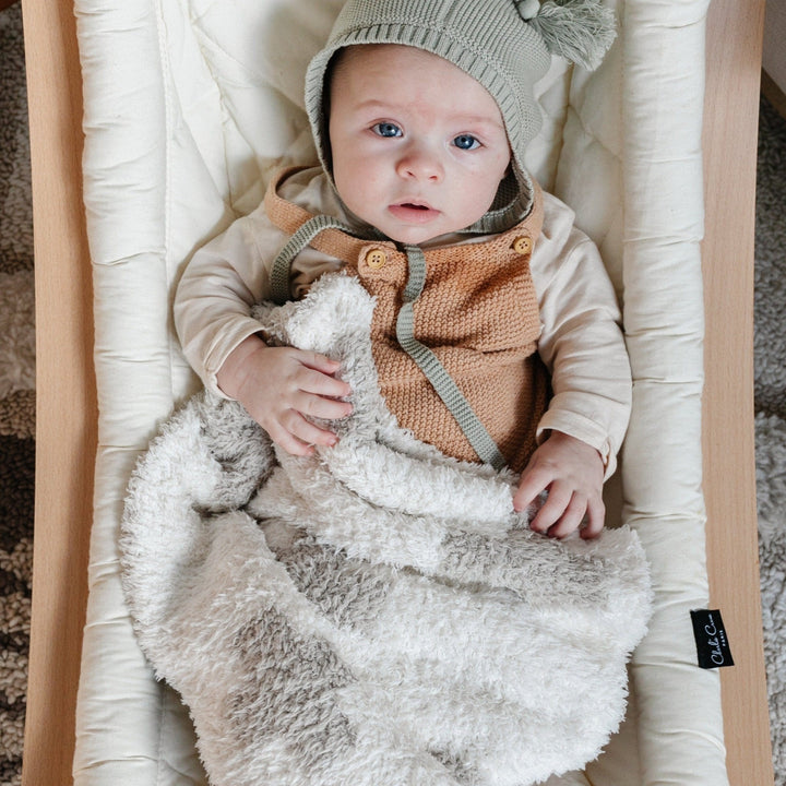 SaranoniÕs Double-Layer BAMBONI¨ Mini Blanket in Swiss Cross adds plush softness to every nap, easily one of the best toddler blankets.