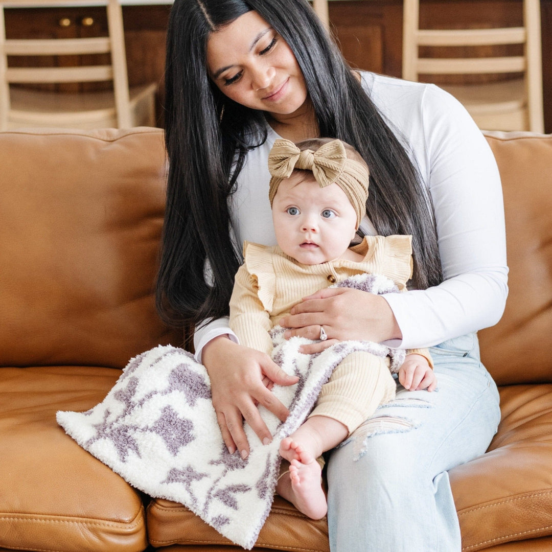 The Pansy Saranoni Double-Layer BAMBONI¨ Mini Blanket brings gentle warmth and durability, a true best toddler blanket essential.