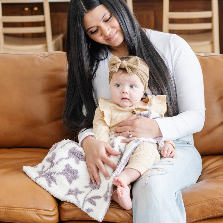 The Pansy Saranoni Double-Layer BAMBONI¨ Mini Blanket brings gentle warmth and durability, a true best toddler blanket essential.