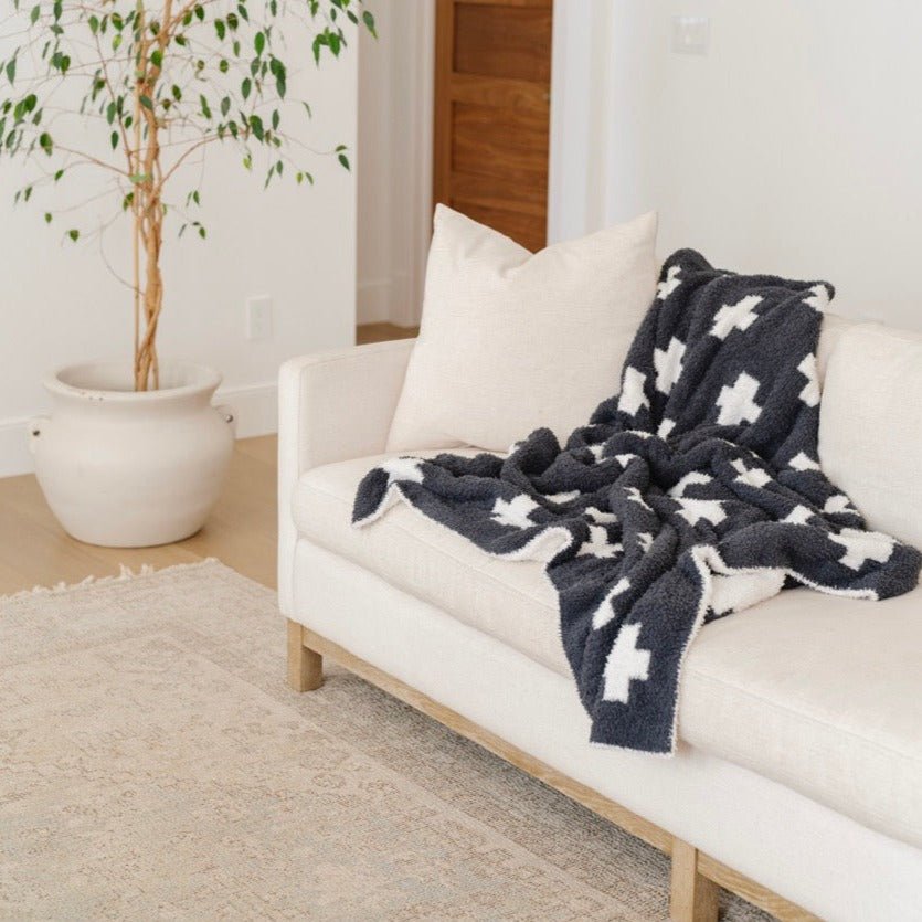 SaranoniÕs Charcoal Swiss Cross Double-Layer BAMBONI¨ Mini Blanket surrounds your baby boy in silky comfort Ñ a top pick for baby boy blankets.