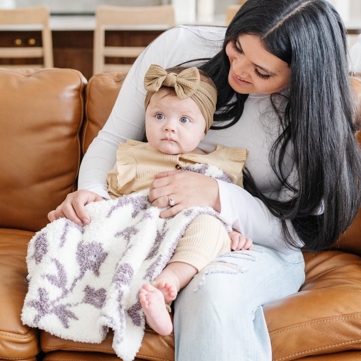 Wrap your toddler in the Pansy Double-Layer BAMBONI¨ Mini Blanket by Saranoni, loved for being one of the best blankets for toddlers.