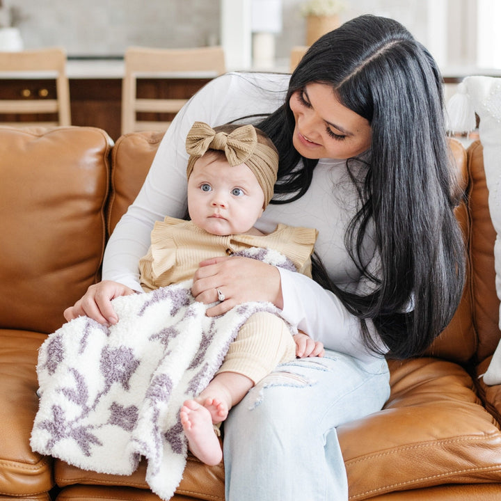 Soft, serene, and stylish Ñ the Saranoni Double-Layer BAMBONI¨ Mini Blanket in Pansy defines what a soft baby blanket should be.