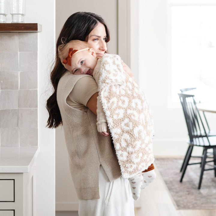 The Tan Leopard Saranoni Double-Layer BAMBONI¨ Mini Blanket gives a soothing touch, designed for long-lasting comfort as a baby boy blanket.