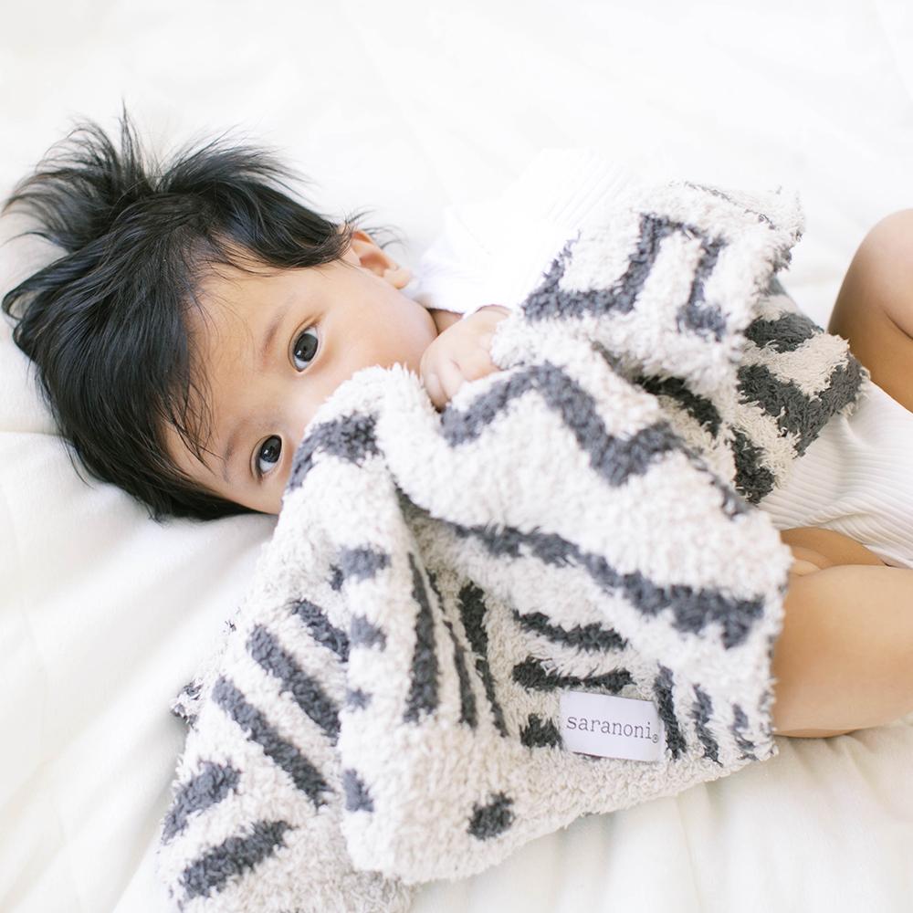The Mudcloth Saranoni Double-Layer BAMBONI¨ Mini Blanket redefines cozy Ñ a luxurious favorite among the best baby blankets.