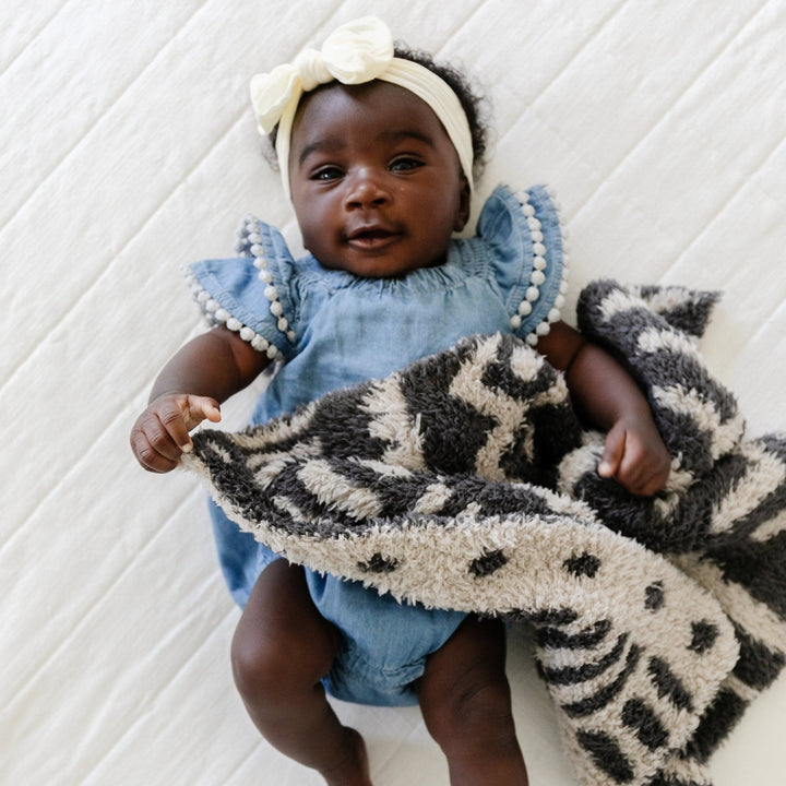 Wrap your baby girl in pure coziness with the Mudcloth Double-Layer BAMBONI¨ Mini Blanket in Fawn, designed for softness and warmth.