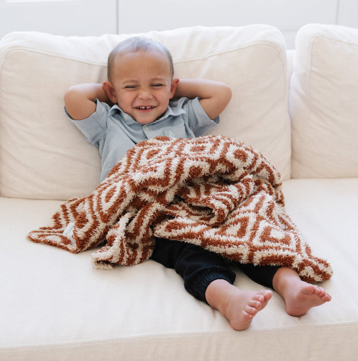 Snuggle sessions feel extra special with the Saranoni BAMBONI¨ Receiving Blanket in Khmer, a must-have baby receiving blanket.