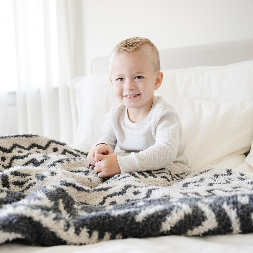 Gentle and plush, the Saranoni BAMBONI¨ Receiving Blanket in Mudcloth works beautifully for both baby boy blankets and baby girl blankets.