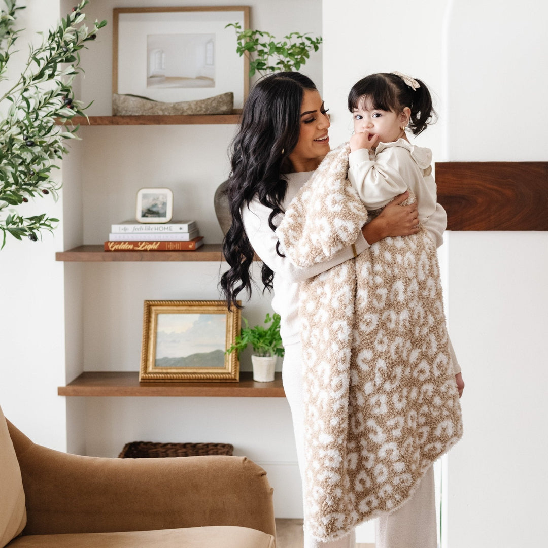 The Tan Leopard Saranoni BAMBONI¨ Receiving Blanket, crafted for luxury, is one of the best baby blankets available.
