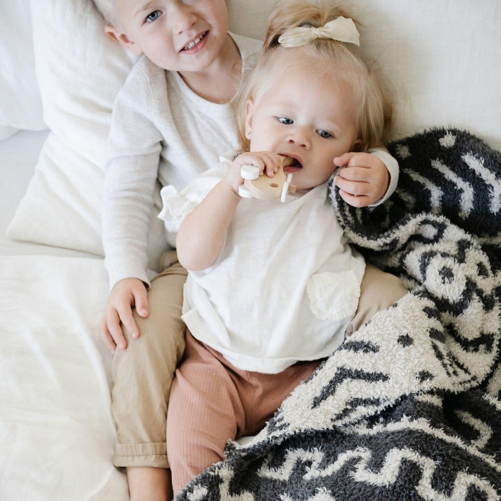 Keep your little one cozy in the Saranoni BAMBONI¨ Receiving Blanket in Mudcloth, the perfect soft baby blanket for every season.
