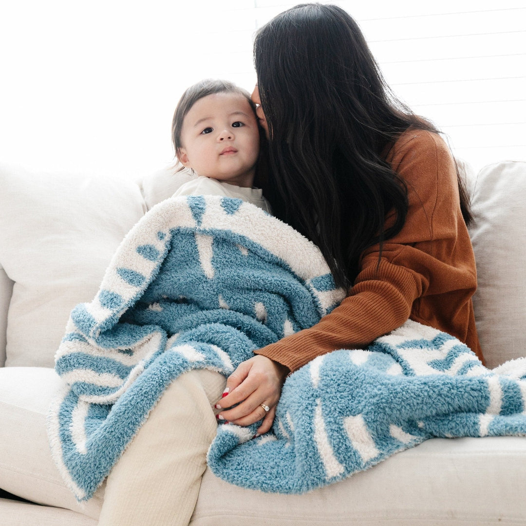 The Triangle Saranoni BAMBONI¨ Receiving Blanket offers gentle warmth, ideal for baby boy blankets.