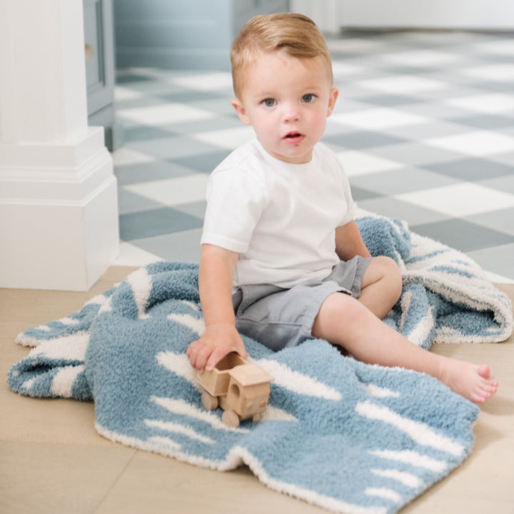 Saranoni BAMBONI¨ Receiving Blanket in Triangle, designed as one of the best baby blankets for any nursery.