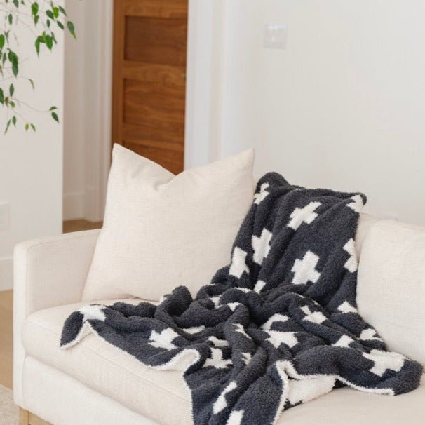 The Saranoni BAMBONI¨ Receiving Blanket in Charcoal Swiss Cross offers plush coziness, perfect for baby boy blankets.