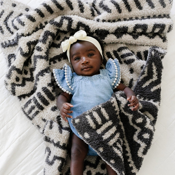 SaranoniÕs BAMBONI¨ Receiving Blanket in Mudcloth combines warmth and stretch, making it one of the best baby blanket options.
