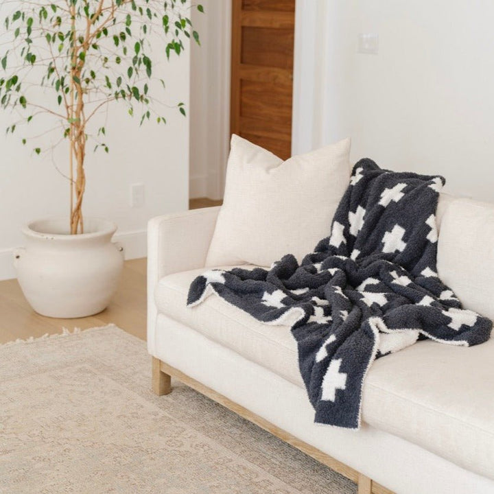 Nothing feels cozier than the Saranoni Double-Layer BAMONI¨ Throw Blanket in Swiss Cross Ñ one of the best toddler blankets for year-round comfort.