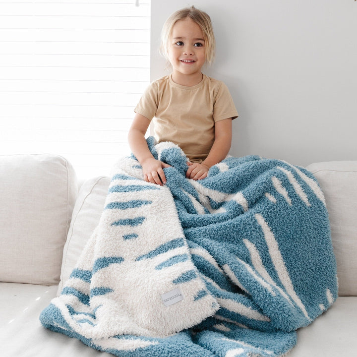 Saranoni Double-Layer BAMBONI¨ Toddler Blankets in Triangle feels luxe and velvety, the perfect toddler blanket.