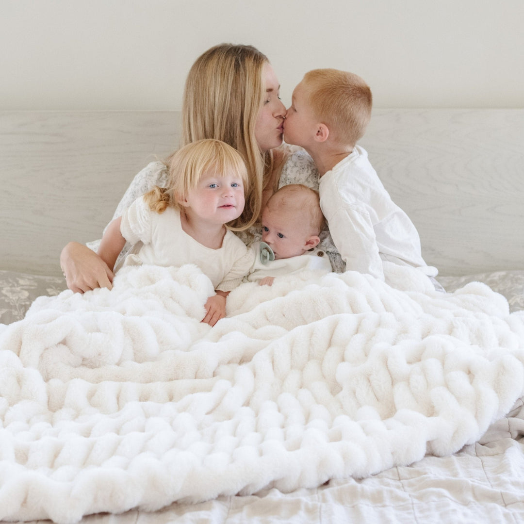 Snow Saranoni Double Ruched Faux Throw Blanket displays elegant rich texture, making it a standout among the Best baby blankets.
