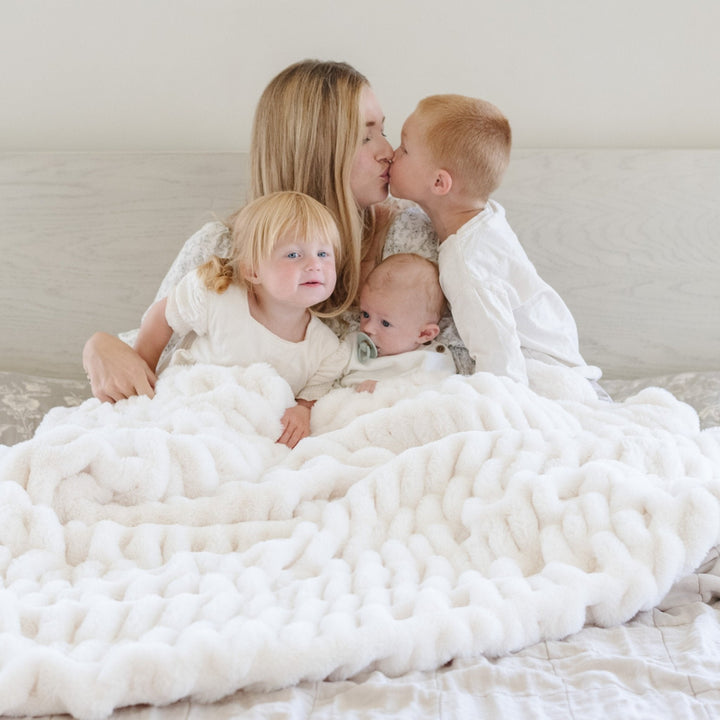 Snow Saranoni Double Ruched Faux Throw Blanket displays elegant rich texture, making it a standout among the Best baby blankets.