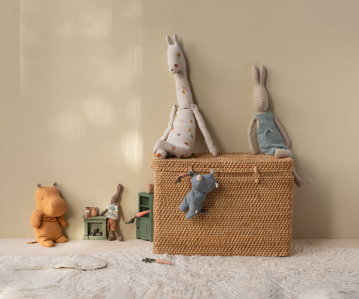Maileg Medium Honey Hippo plush displayed in woven basket with Maileg toys and nursery decor